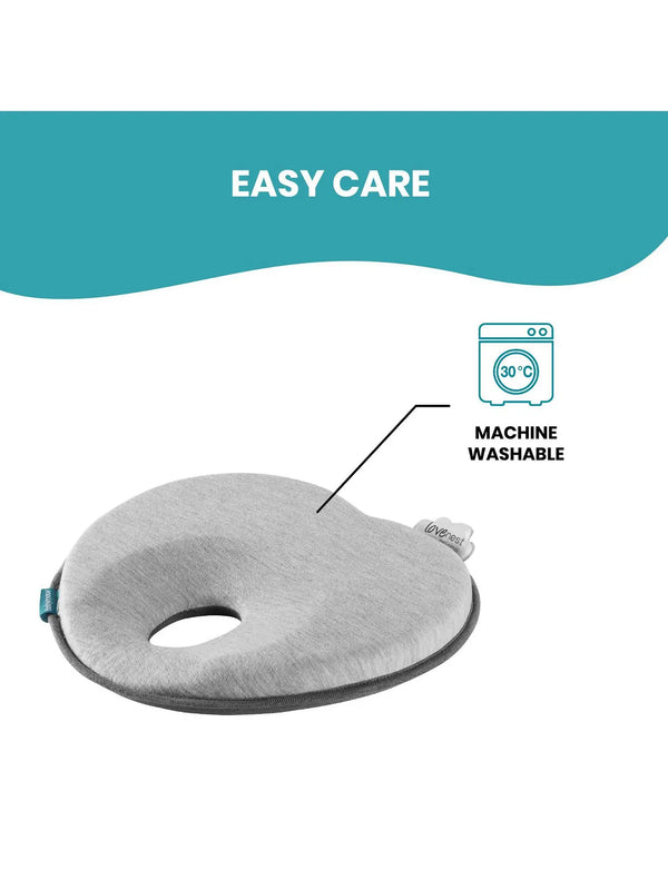 Gray baby head support cushion with a central opening and soft padded surface.