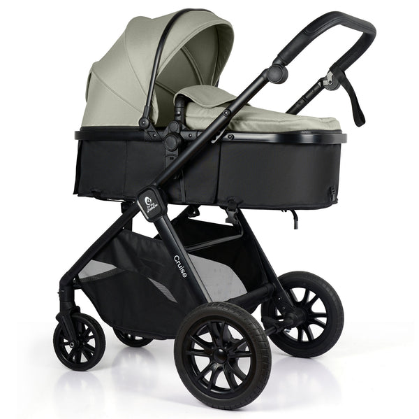 Sage-green stroller travel system with black frame, bassinet seat, and canopy