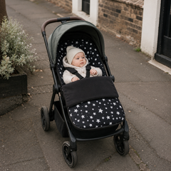 Universal fleece pushchair footmuff with black cover and white star print