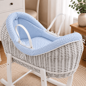 Blue wicker baby Moses basket with white stand and padded pod liner