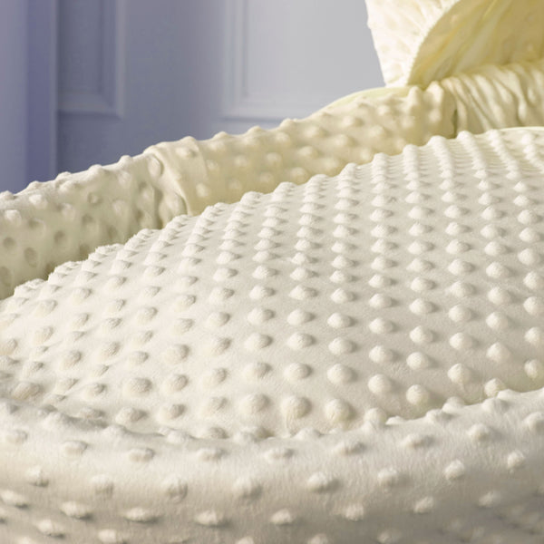 Cream dimple knit Moses basket mattress cover with raised dot texture