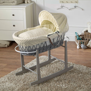 Grey wicker Moses basket on stand with cream fabric canopy and padded base