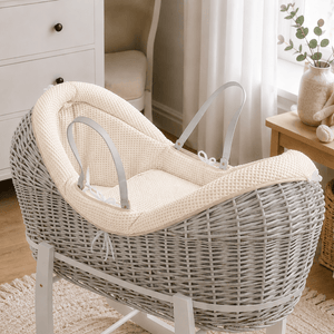 Cream wicker baby Moses basket with white stand and padded pod liner