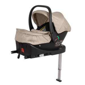 Black infant car seat with beige canopy, side belts, and base legs
