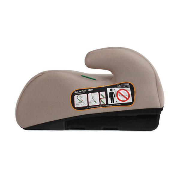 Latte beige booster seat side profile with safety label on the headrest