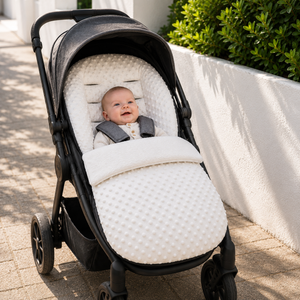 Beige textured pushchair footmuff with open top and arm opening