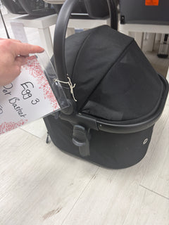 Dark gray pet stroller carrier with curved handle, canopy, and front storage panel
