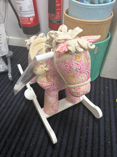 Pink paisley fabric plush rocking horse with cream padded head and white rockers