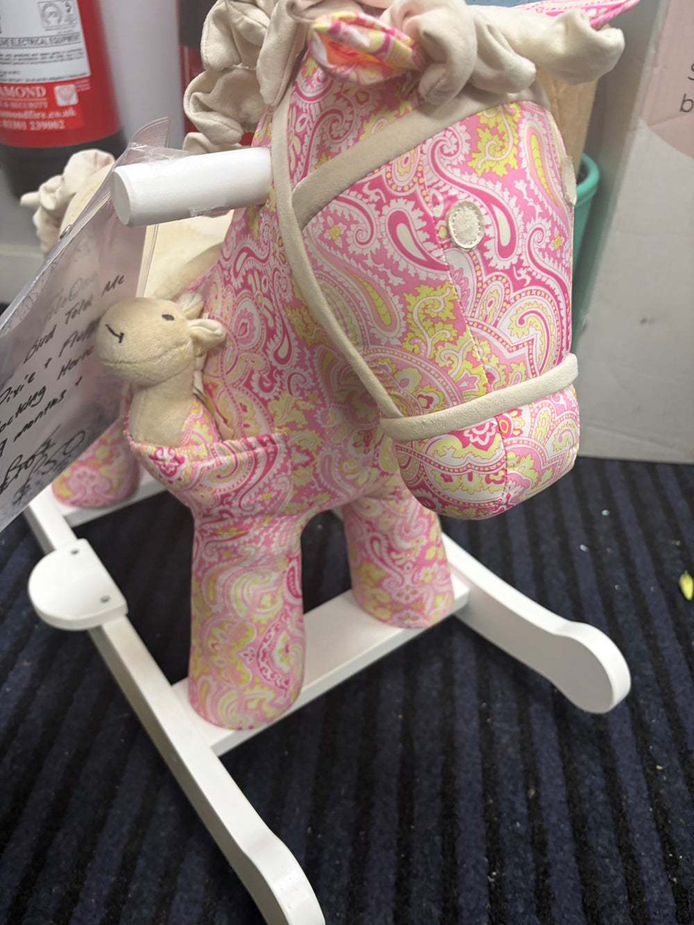 Pink paisley fabric plush rocking horse with cream padded head and white rockers