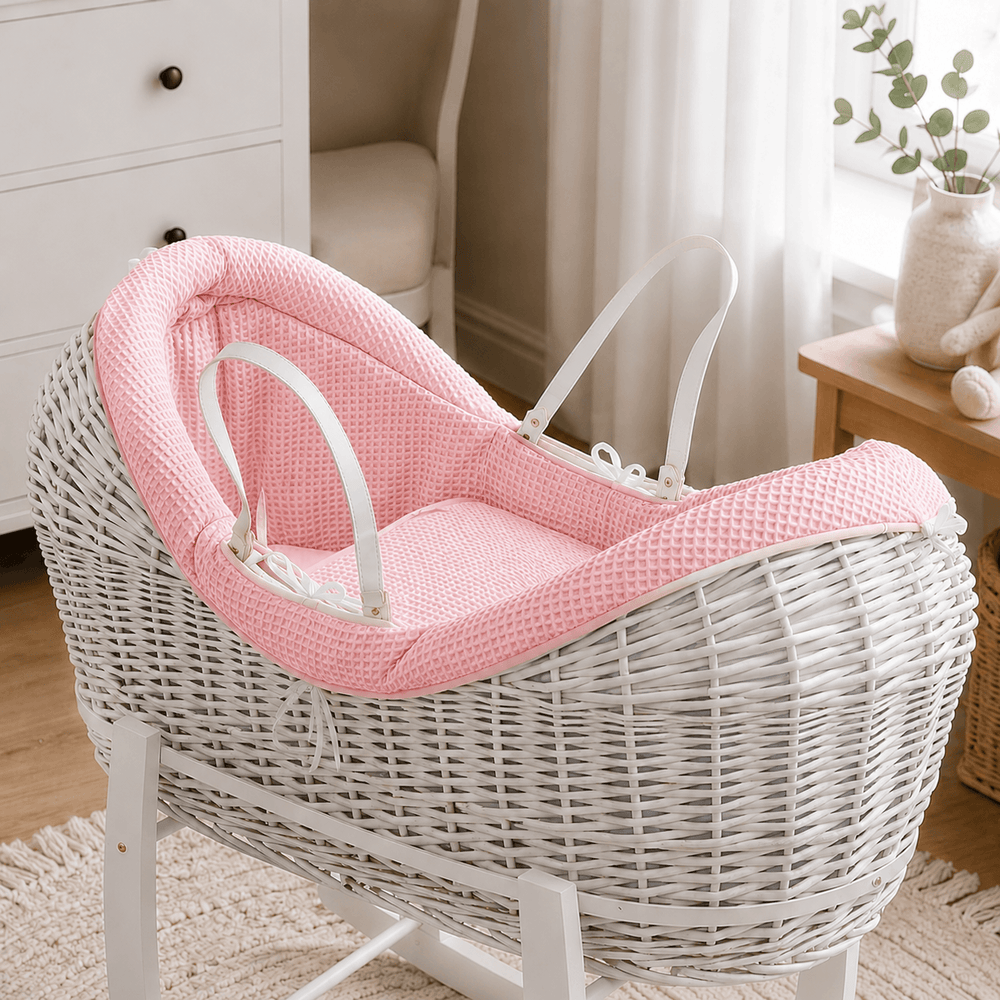 Pink waffle moses basket bedding liner with white ties and padded headrest