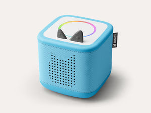Sky blue Toniebox 2 audio player with a perforated speaker front and rainbow ring on top