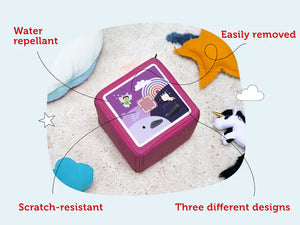Magenta Toniebox 1 topper with a purple rainbow design, shown as water-repellent and removable