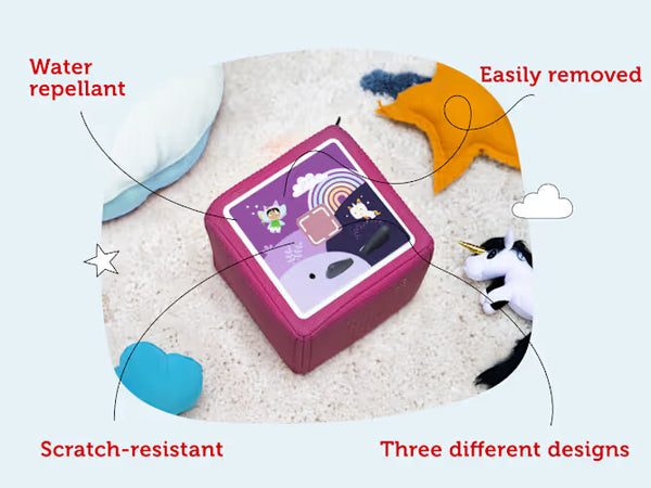 Magenta Toniebox 1 topper with a purple rainbow design, shown as water-repellent and removable
