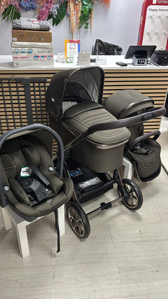 Gray stroller bundle with bassinet and car-seat, black wheels, and padded seat cushions