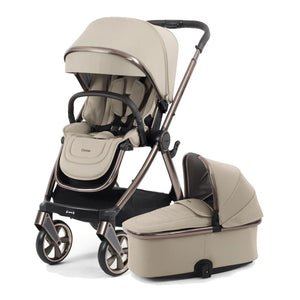 Beige 4-in-1 stroller with bassinet and seat modules, three-quarter view