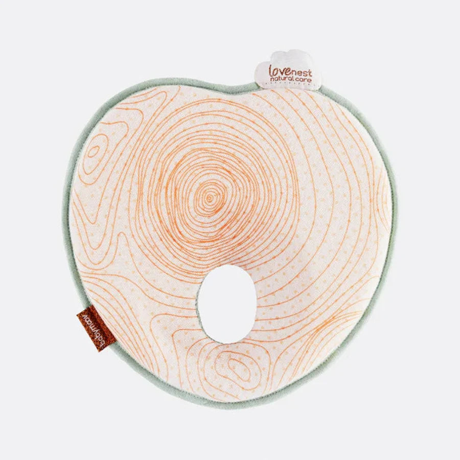 
              Babymoov Lovenest Natural Care baby head support with orange contour print and central opening
            