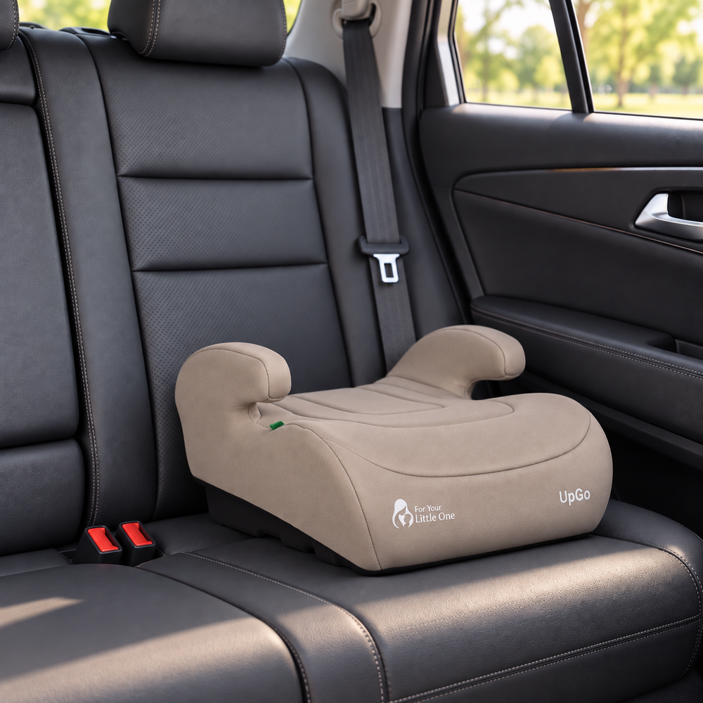 Latte beige booster seat with side arm rests, contoured cushion, and label